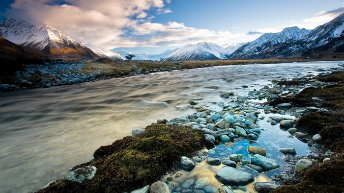 River flowing through snowy mountains in New Zealand