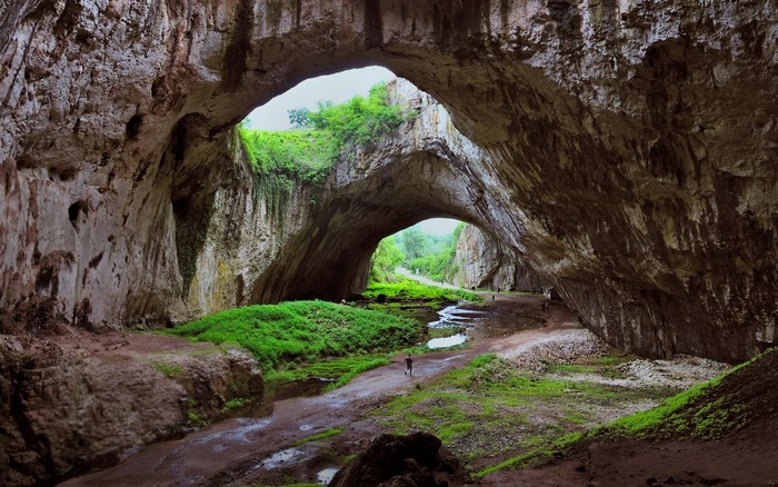 Huge Cave with River and Green Grass in Bulgaria