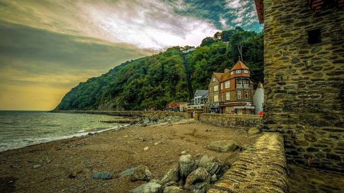 Coastal village with a funicular railway on a forested hill