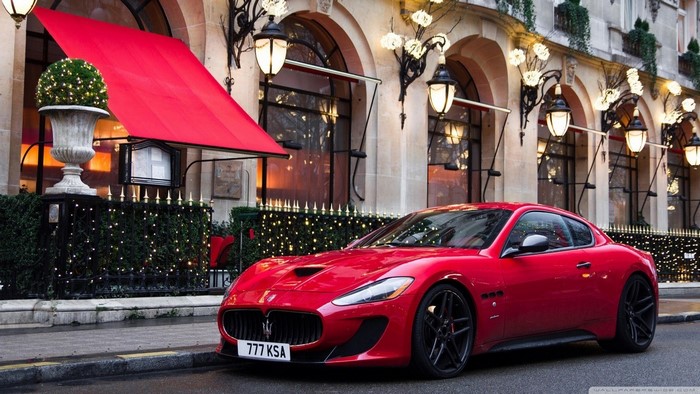 Red Maserati GranTurismo MC Stradale parked on a street