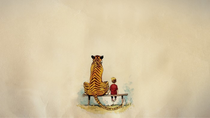 Calvin and Hobbes sitting on a bench