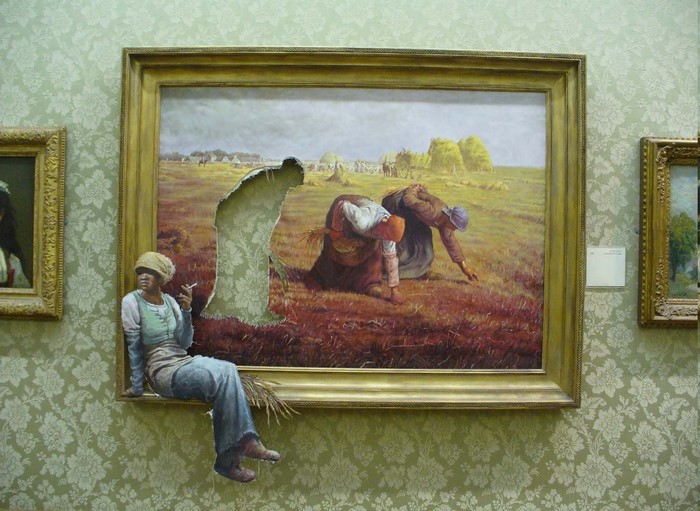 Woman sitting on painting frame in gallery