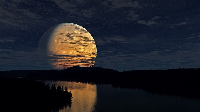 Moon over a dark forest and river