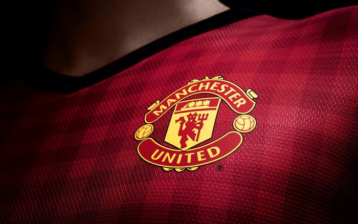 Manchester United logo on a red jersey