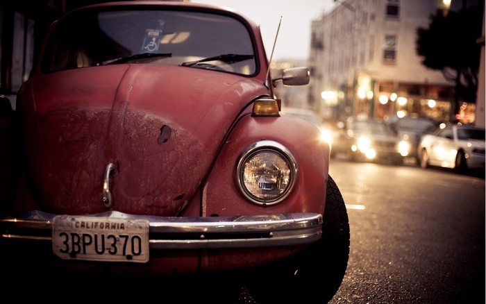 Red Volkswagen Beetle car with California license plate