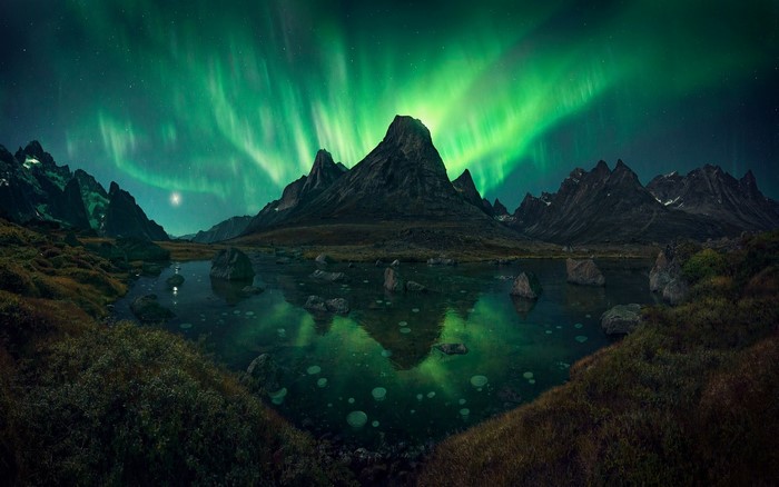 Aurora Borealis Over Mountain Lake at Night