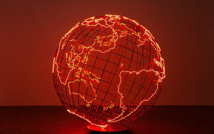 Wireframe globe with neon continents