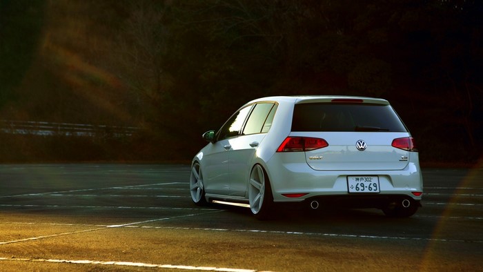 White Volkswagen Golf VII on parking lot