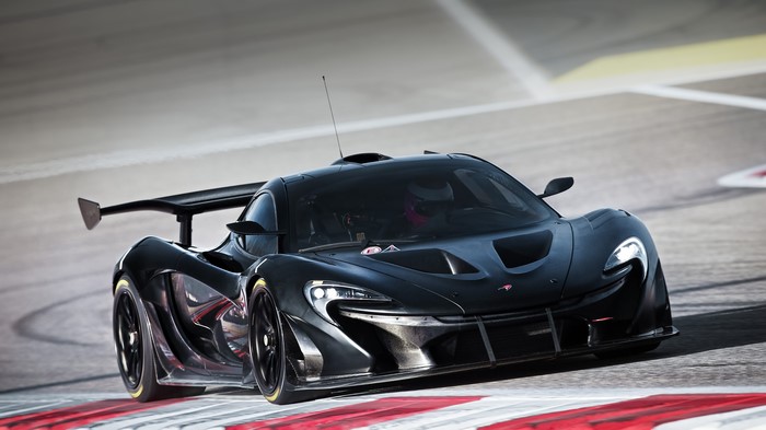 Black McLaren P1 GTR race car on track