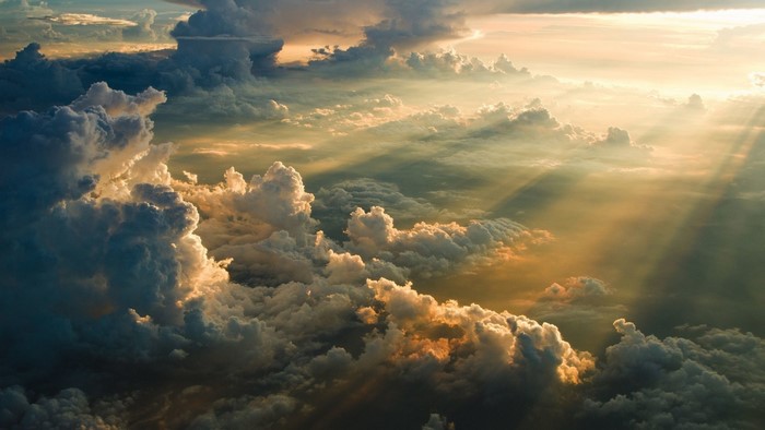 Aerial view of sun rays through clouds