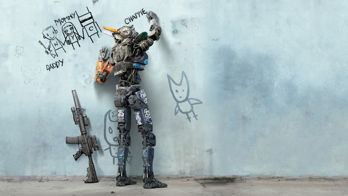 Chappie robot drawing on wall with gun