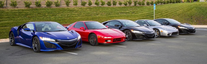 Acura NSX cars parked in a lot