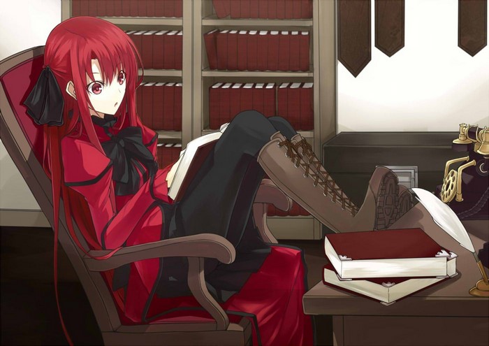 Redhead girl reading in a library