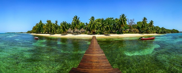 Tropical Island with Wooden Dock and Clear Sea