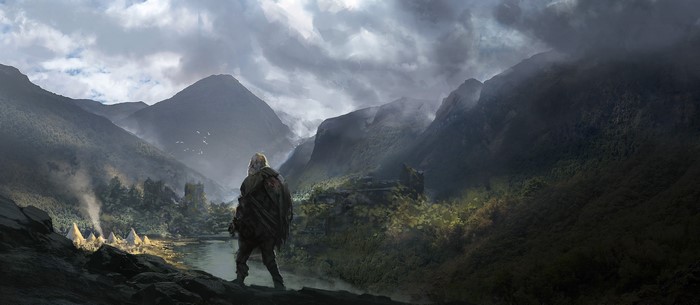 Fantasy landscape with a lone figure overlooking a village