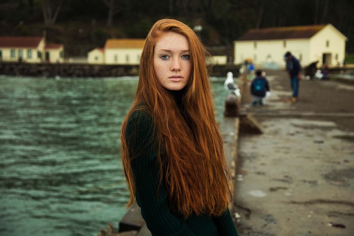 Redhead woman with freckles and blue eyes