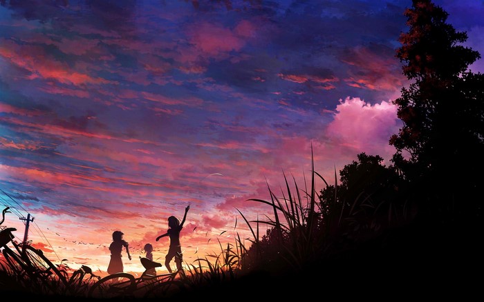 Children playing at sunset with bicycles