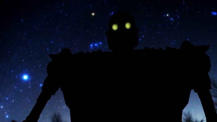The Iron Giant silhouetted against a starry night sky