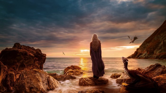 Daenerys Targaryen from Game of Thrones on a beach with dragons