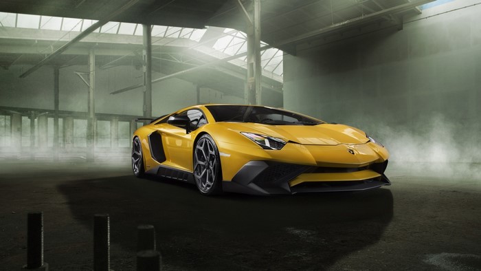 Yellow Lamborghini Aventador in a warehouse