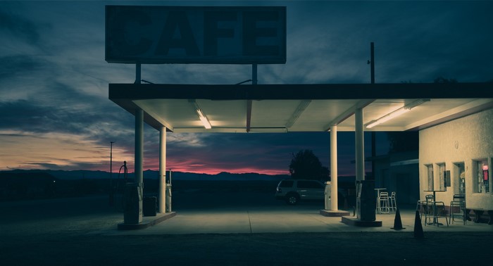 Gas station cafe at dusk with colorful sky