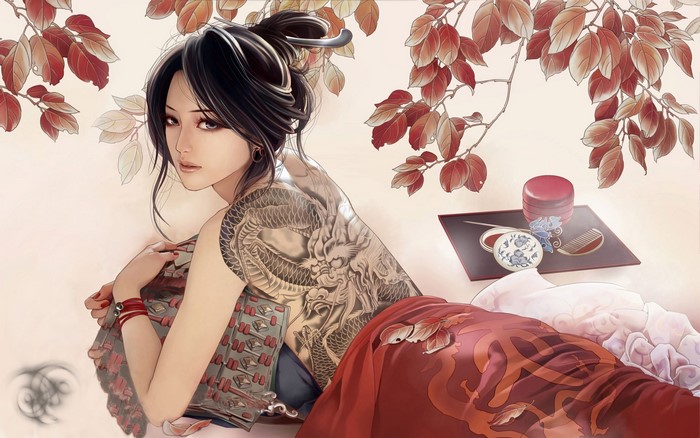 Woman with dragon tattoo and traditional Japanese items