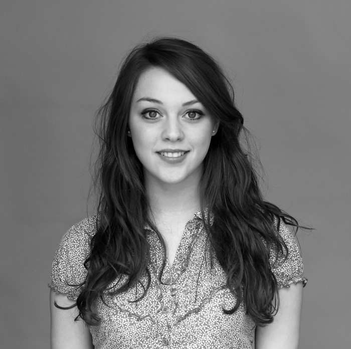 Imogen Dyer smiling with long hair