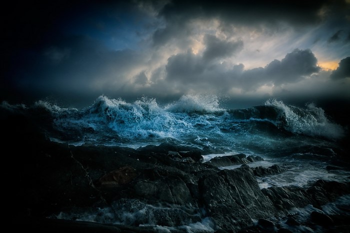 Stormy sea with crashing waves against rocks
