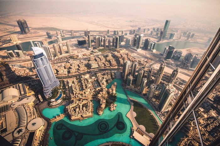 Dubai cityscape with skyscrapers and desert background