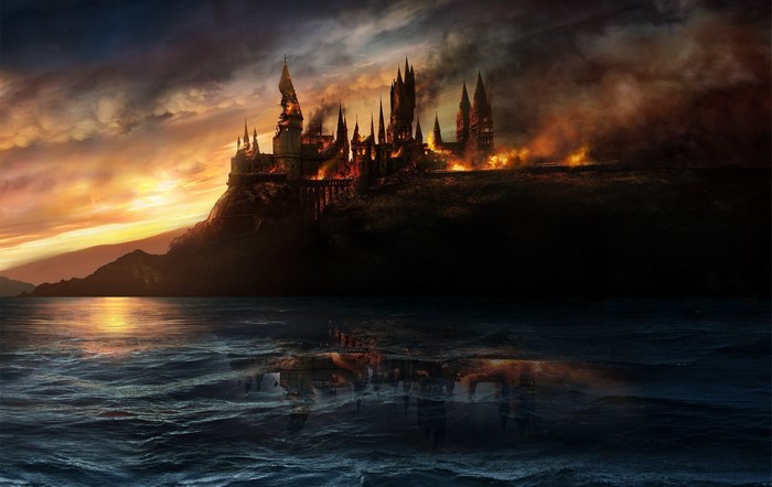 Hogwarts Castle in flames over water