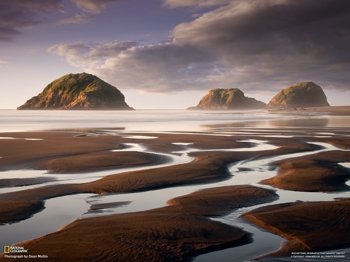 Beach with rock formations and water patterns