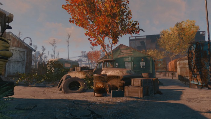 Fallout 4 apocalyptic scene with trucks and buildings