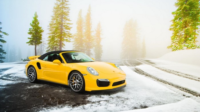 Yellow Porsche Convertible in Snowy Forest