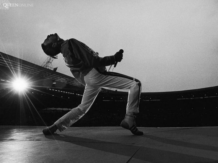 Freddie Mercury performing on stage