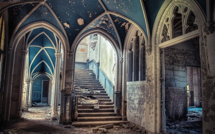 Abandoned Gothic Hallway with Grand Staircase