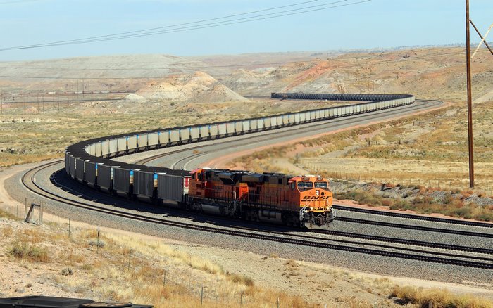 BNSF Freight Train Carrying Coal in a Desert Landscape