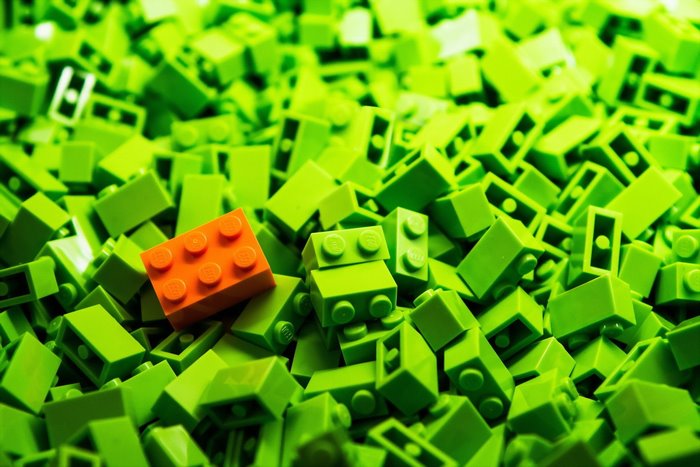 Pile of green and orange Lego bricks