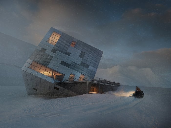 Modern cube building in snowy mountains with snowmobile