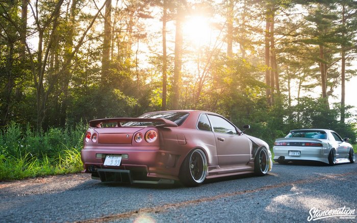 Nissan Skyline R34 and Silvia S14 on a road