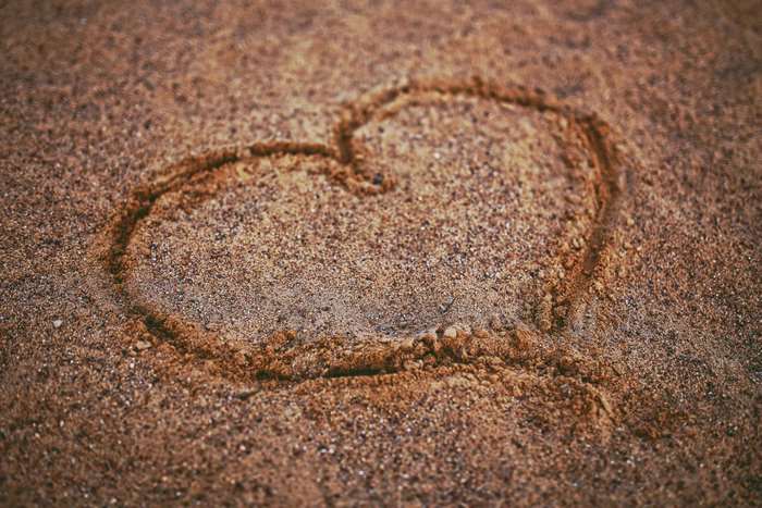 Heart drawn in sand