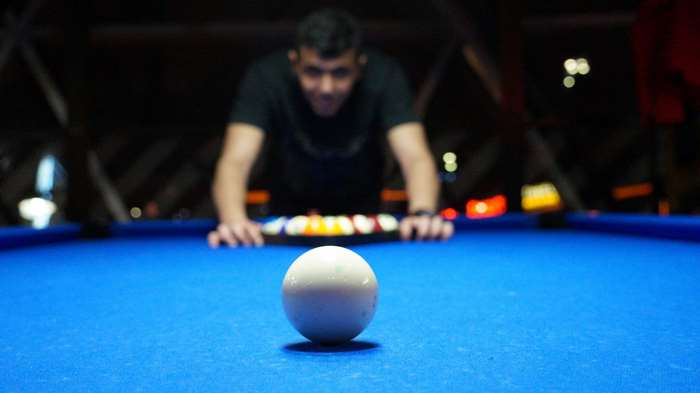 Man playing pool billiards 4K