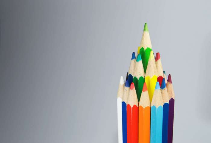 Colorful pencils arranged in a pyramid shape