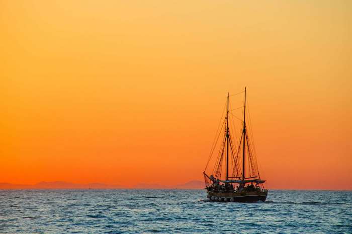 Sailing vessel on the sea at sunset