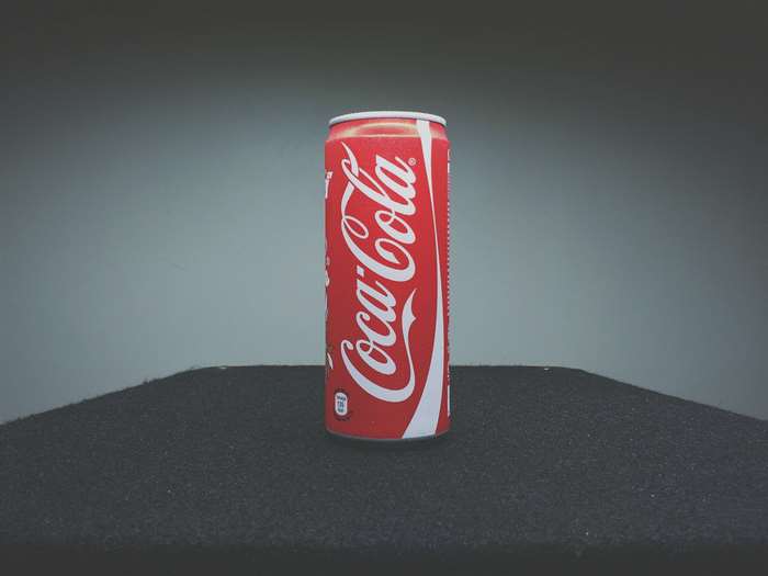Coca-Cola can on a dark surface