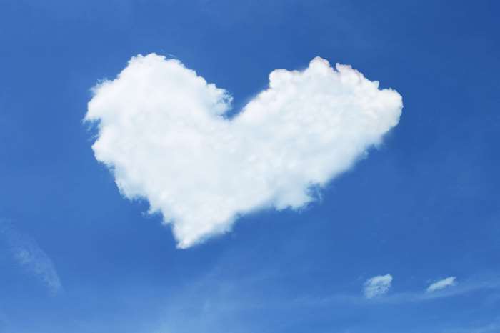 Heart-shaped cloud in a blue sky