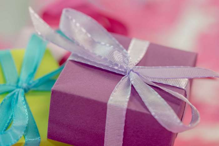 Purple and yellow gift boxes with ribbons