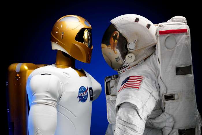 Robot and Astronaut Face Off
