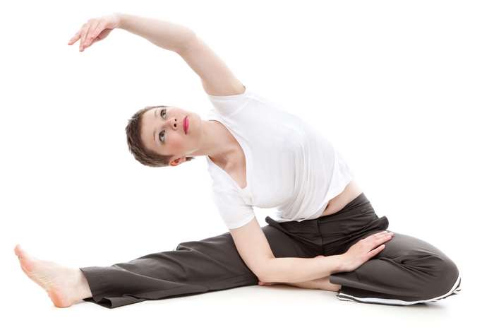Woman doing a side stretch in yoga 4K