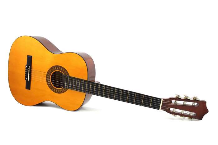 Acoustic guitar with wooden body and strings