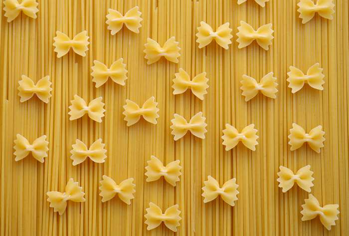 Farfalle pasta on spaghetti noodles 4K